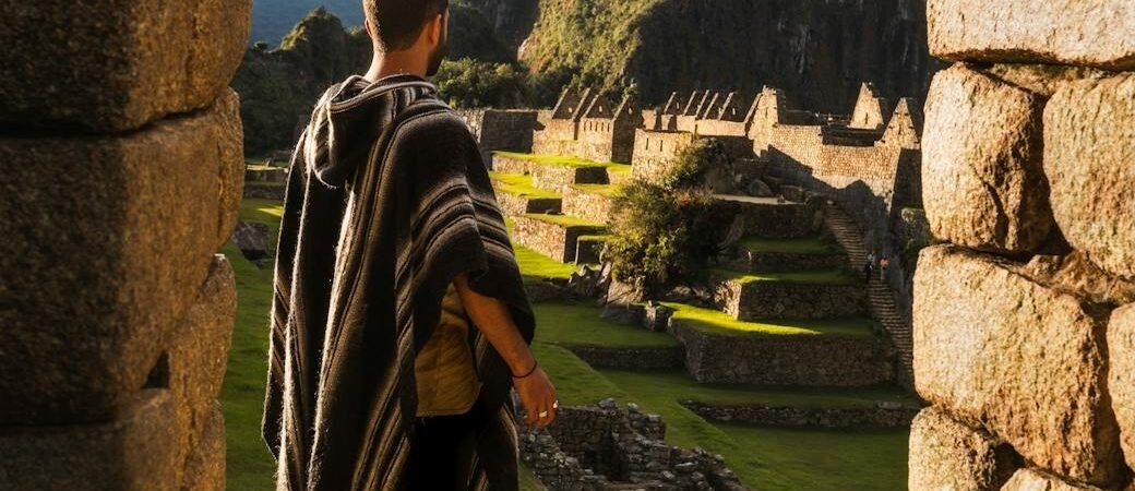 man wearing striped poncho